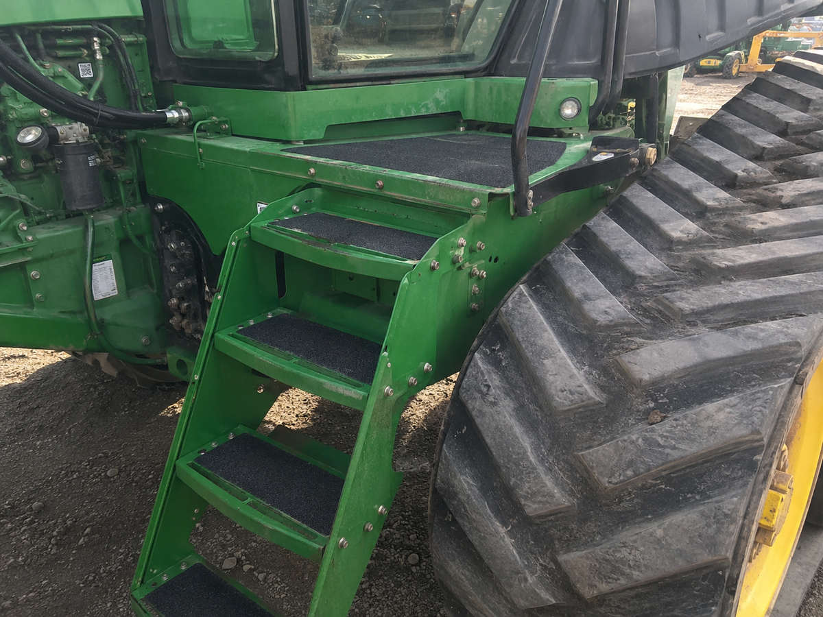 Custom anti-slip step treads installed on heavy agricultural equipment