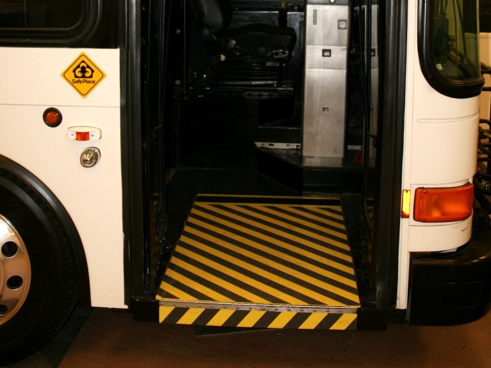 Anti-slip traction surface installed on a public transit vehicle entrance